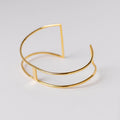Pulsera abierta delicada con baño de oro de INDIGO