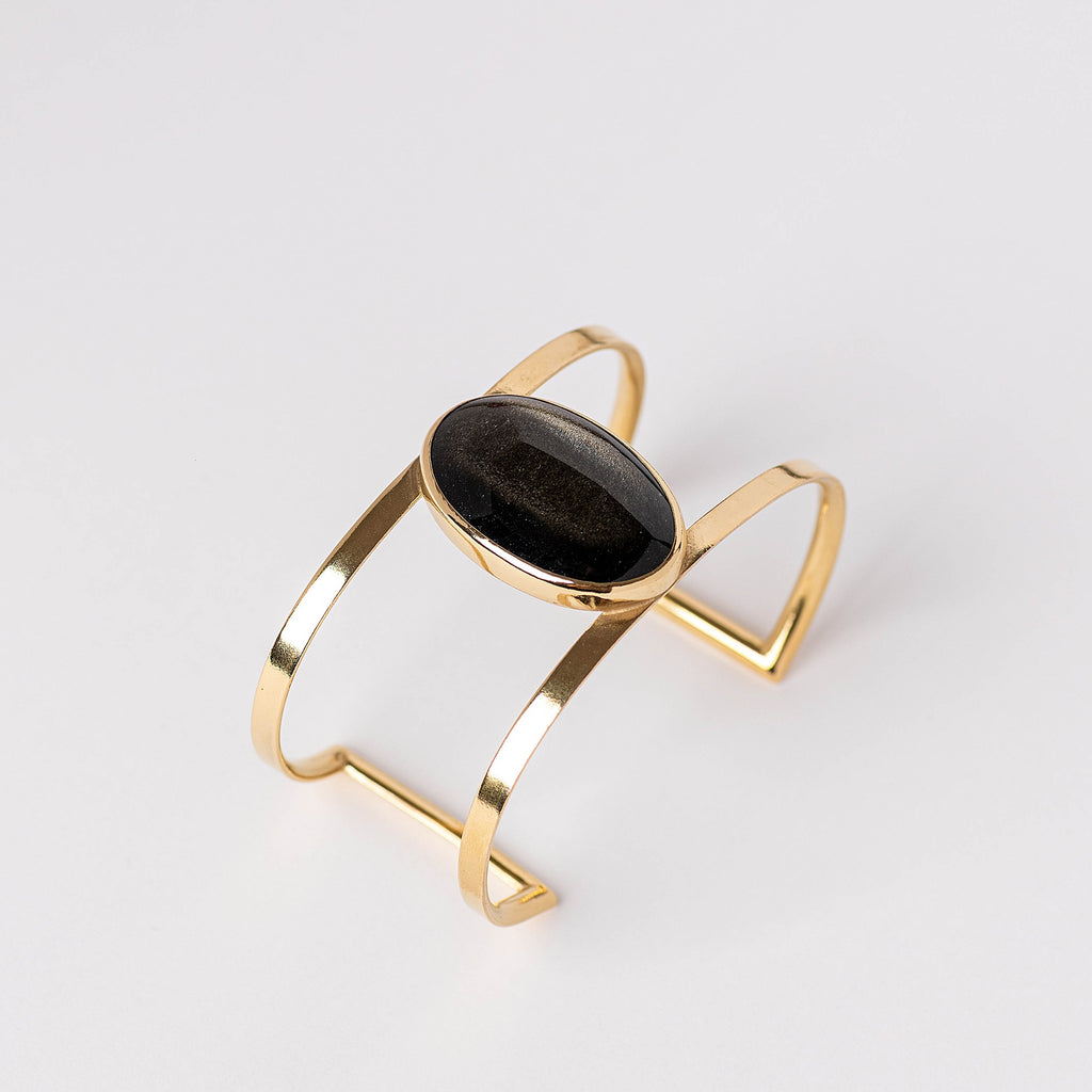 Pulsera escultórica abierta con obsidiana dorada y baño de oro de INDIGO