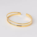 Pulsera abierta de doble línea con baño de oro de INDIGO